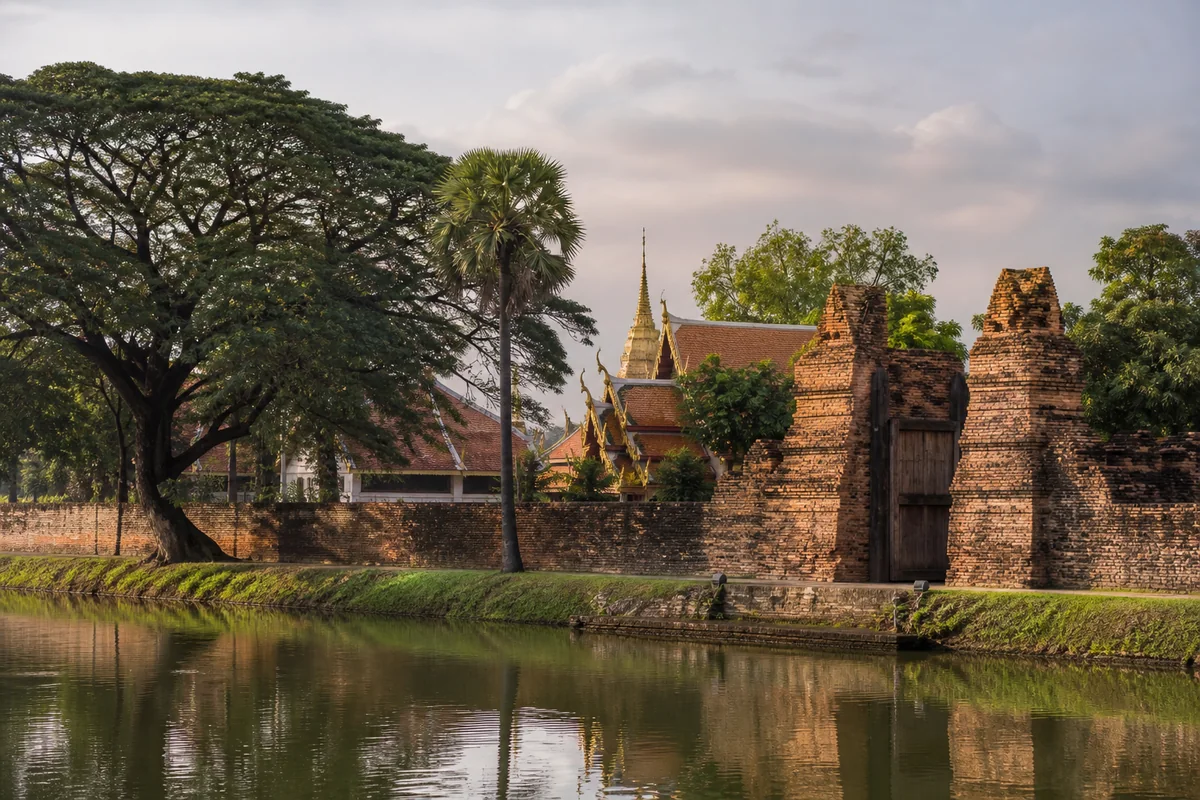 Chiang Mai old city walls, water, trees, and traditional architecture